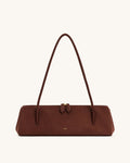 Brown handbag with a strap on a white background